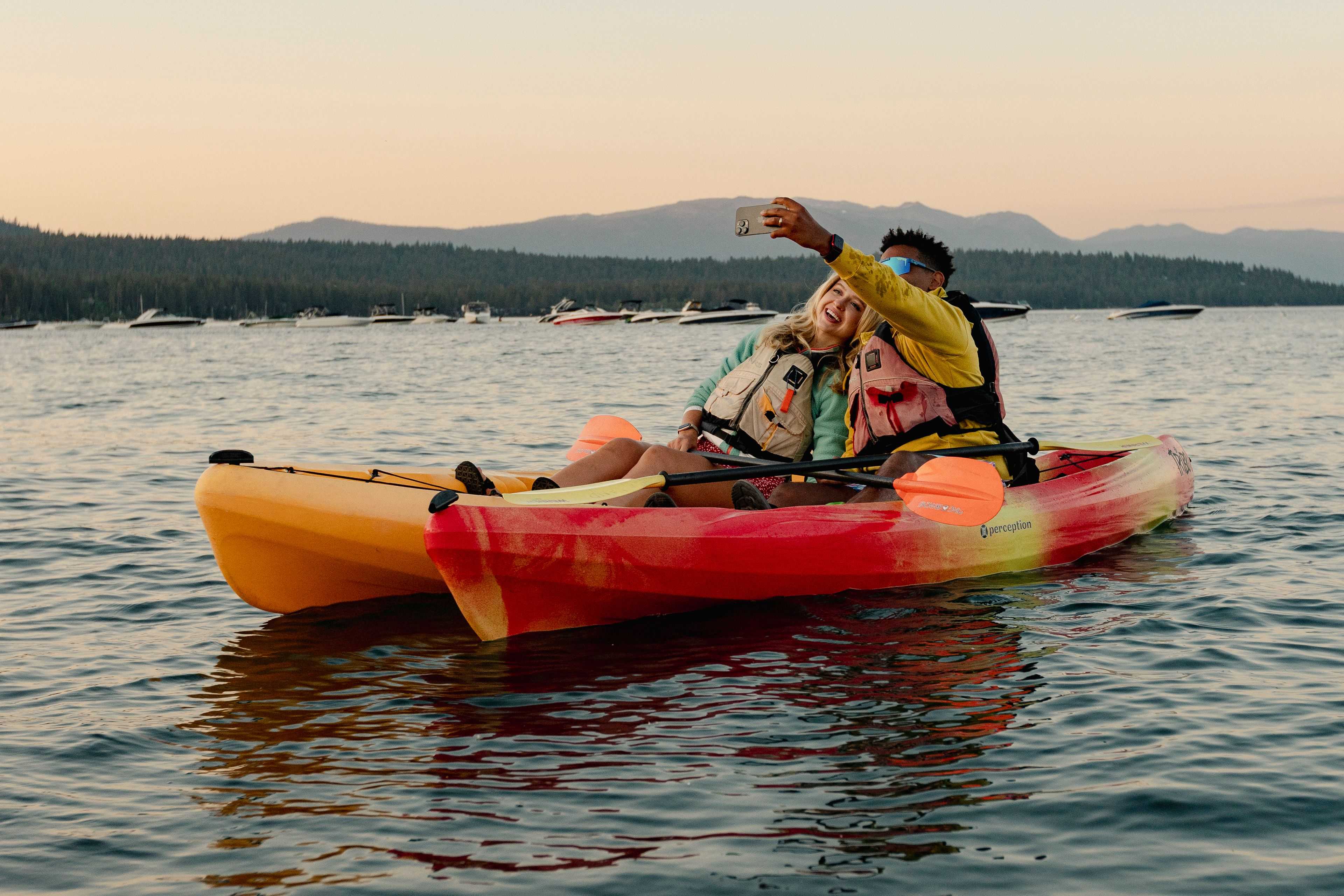 happy couple kayaking on Lake Tahoe